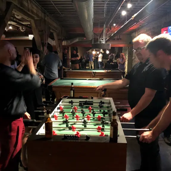 The team playing foosball